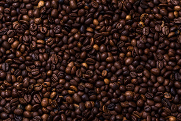 fried coffee beans. coffee beans, on a wooden background