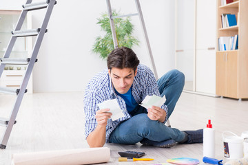 Young man overspending his budget in refurbishment project