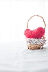 Red heart with small Wooden basket.