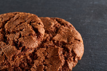 Chocolate chips cookies isolated on black background, macro, close-up