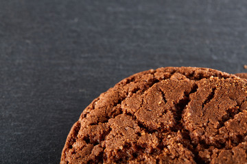 Chocolate chips cookies isolated on black background, macro, close-up