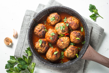 Meatballs in tomato sauce in a frying pan top view. 