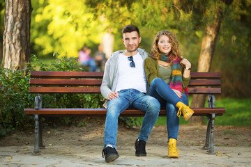 Fototapeta premium Young couple in park in front of a camera