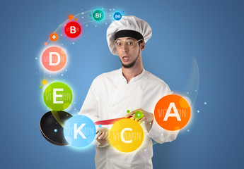 Handsome cook with vitamin concept