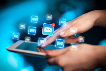Fingers touching tablet with mail
