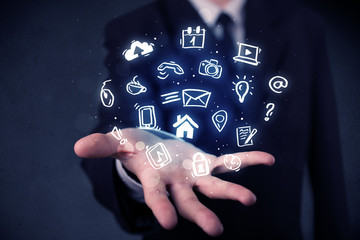 Businessman holding blue applications