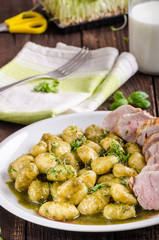 Pork tenderloin with herbs and spices, pesto gnocchi
