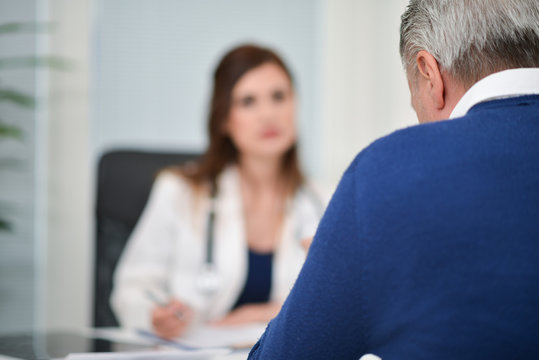 Patient talking to a doctor during a visit