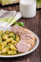 Pork tenderloin with herbs and spices, pesto gnocchi
