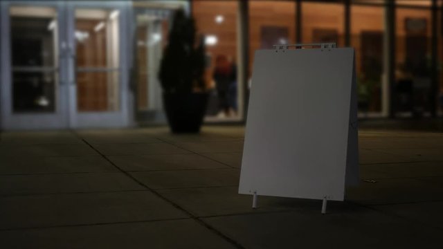 A Blank foldout sign in front of a theater entrance