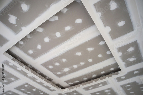 Ceiling Gypsum Board Installation At Construction Site