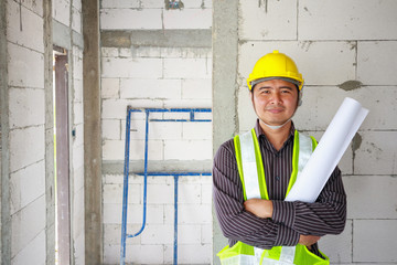 Asian business man construction engineer worker at house building site