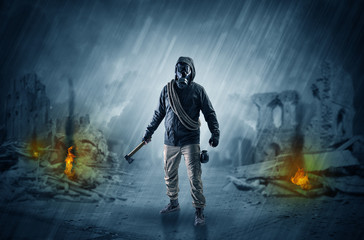 Fototapeta premium After catastrophe men coming in gas mask and arms