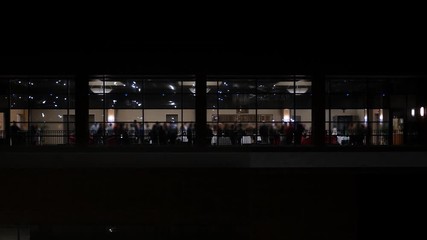 A Corporate Office Party high up in a skyscraper with wealthy socialites - faces blurred