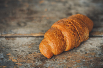 croissant on a wooden surface