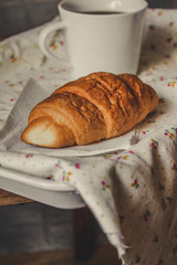 croissant on a wooden surface