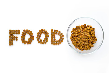Word FOOD mark made of dry food with full bowl. Pet care and veterinary concept with letters on white background.