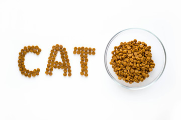 Word CAT mark made of dry food with full bowl. Pet care and veterinary concept with letters on white background.