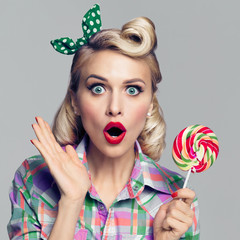 beautiful woman with lollipop, dressed in pin-up style