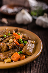 Pork medallions with vegetable and soy garlic sauce