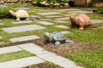 Three figures of turtles in the park