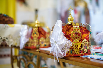 Fototapeta na wymiar golden crowns lying on the table in church