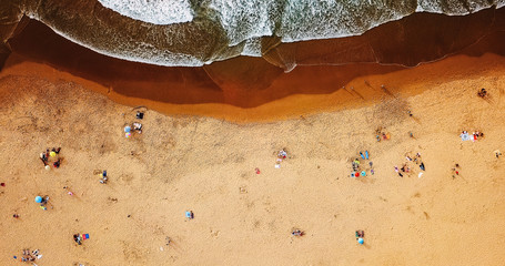 Aerial Summer Top View From Flying Drone Of People Crowd Having Fun On Beach In Portugal