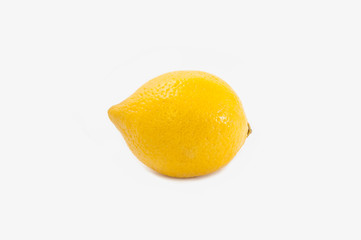 One bright juicy yellow lemon isolated on white background. Frontal view. Citrus Tropical Fruit.