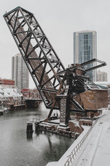 Raised bridge over river in urban area