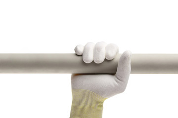 Horizontal plastic pipe in the hand in white glowe on white background isolated.