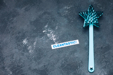 Cleaning house or office concept. Blue star cleaning brush, Cleantastic inscription on a dark...