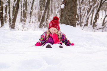 Fototapeta na wymiar Kid bury under white cold snow.