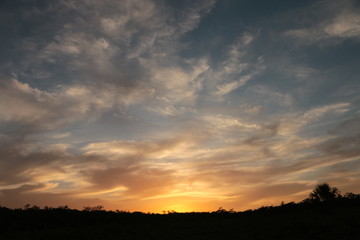Fototapeta na wymiar Sunset in blue and orange cloud sky