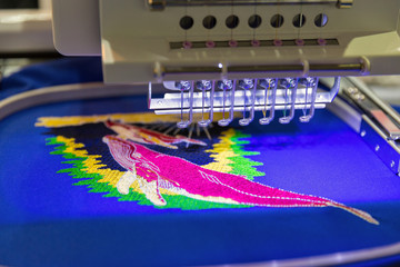 Professional machine for applying embroidery closeup