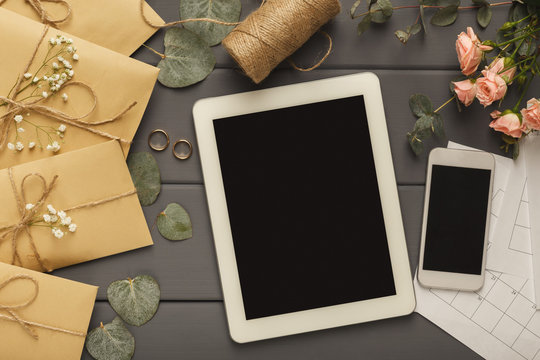 Wedding envelopes on grey wooden table