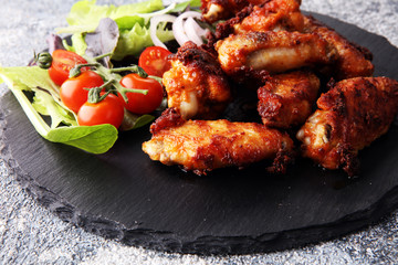 crispy barbecue chicken wings bbq on grey background