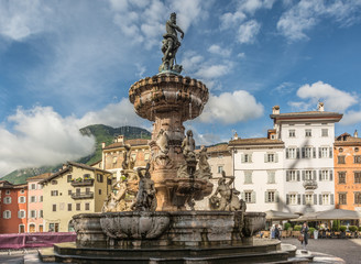 Fototapeta na wymiar The baroque Fountain of Neptune at Piazza del Duomo in the center of the city of Trento in the region of Trentino Alto Adige, South Tyrol
