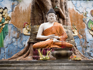 Statue of the Buddhist God Buddha in the Buddhist temple Brahma Vihara Arama with statues of the...