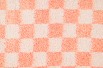 Background of felt fabric: white and pink squares.