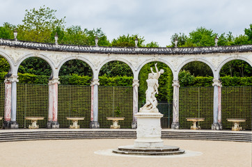  Colonnade fountains with statue The Rape of Proserpina in the gardens of Versailles