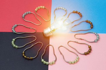 concept idea with lamp and colorful pearl curtain hook