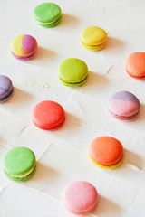 multicolored macaroons on light background, geometric layout