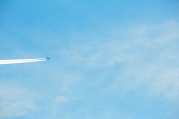 airplane contrail against clear blue sky