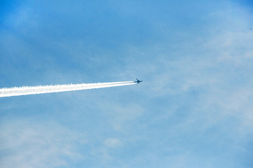airplane contrail against clear blue sky