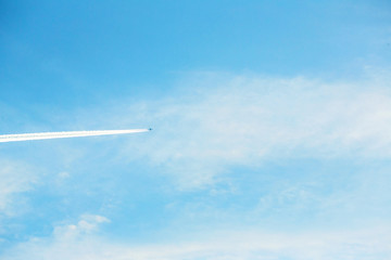 airplane contrail against clear blue sky