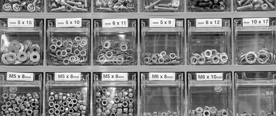 bolts and nuts in the hardware store - obrazy, fototapety, plakaty