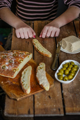 ciabatta - bread with olives on a wooden surface