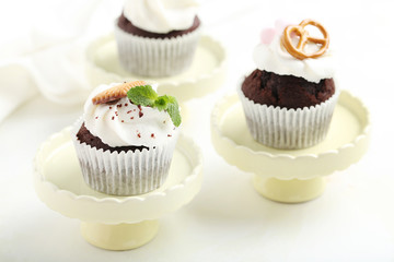 Chocolate cupcakes on a white wooden table
