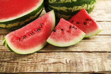 Slices of watermelons on brown wooden table