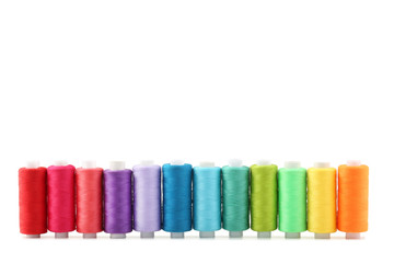 Colourful thread spools isolated on a white